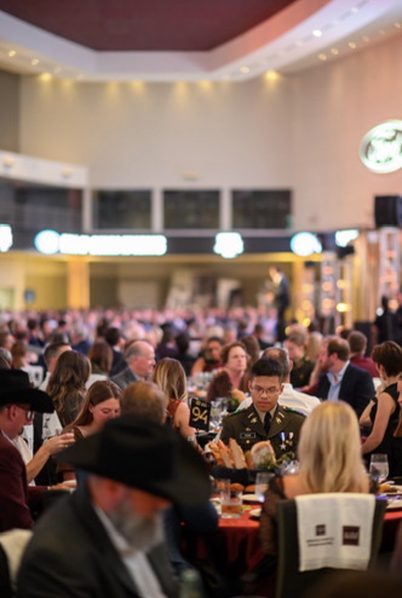 A Texas A&M cadet in uniform at the Aggie 100 dinner