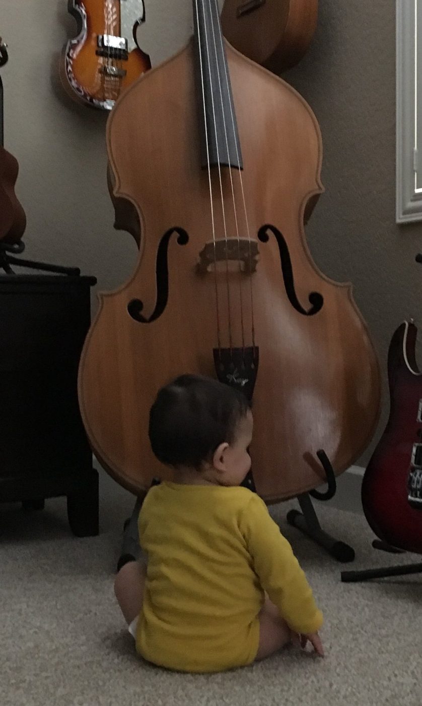My younger son, Christian, with his great-grandfather’s bass.