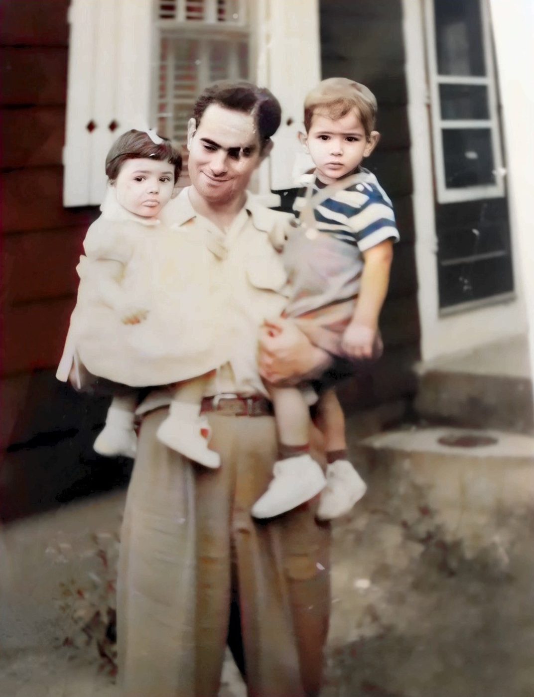 Holding my dad, right, and my dad’s second cousin Lucille Coccio. Colorized.