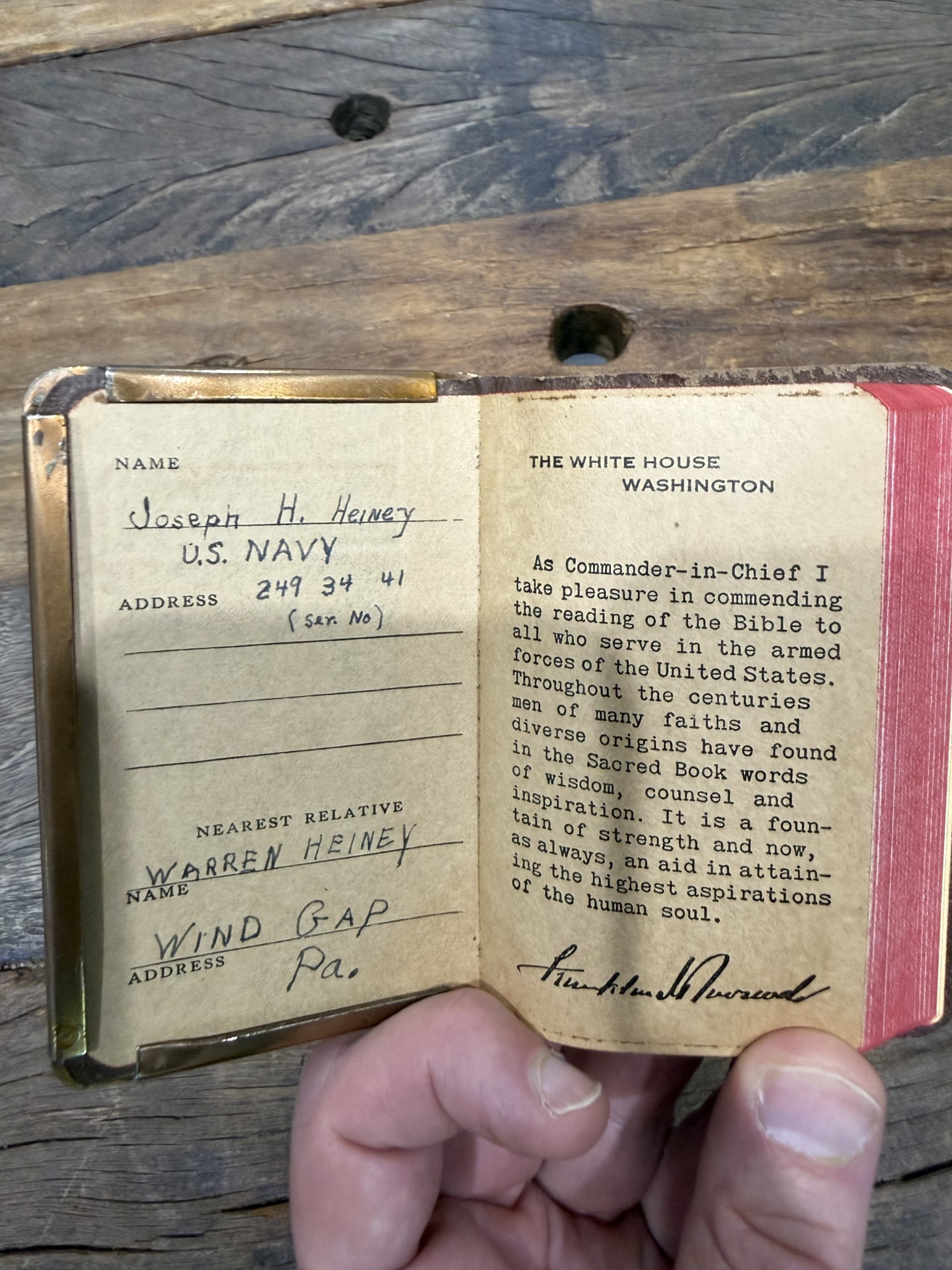 Inside the front cover: Joseph Heiney's name and service number, beside the message from the White House.