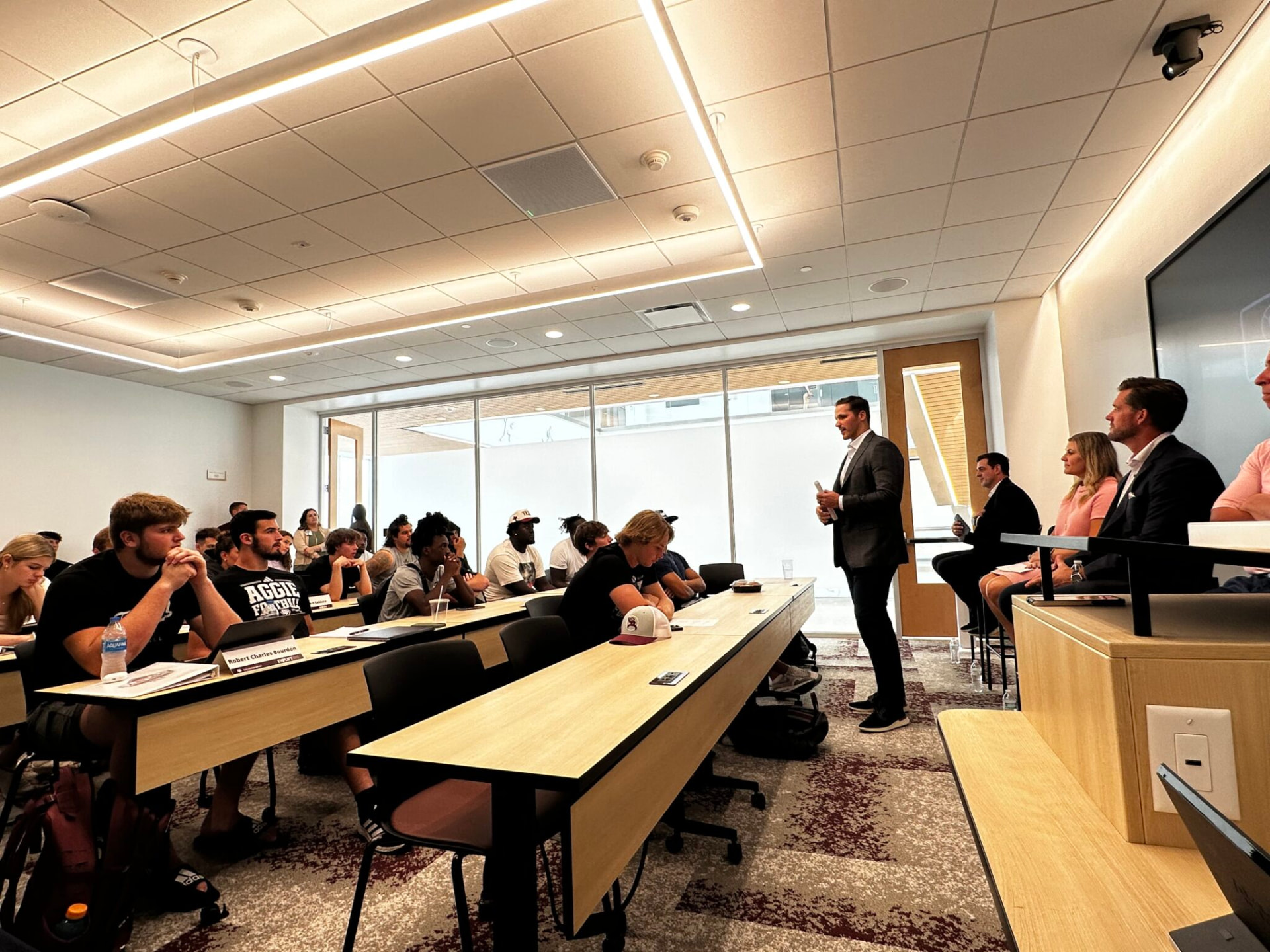 Luke Joeckel speaks to student-athletes in an AmplifyU class