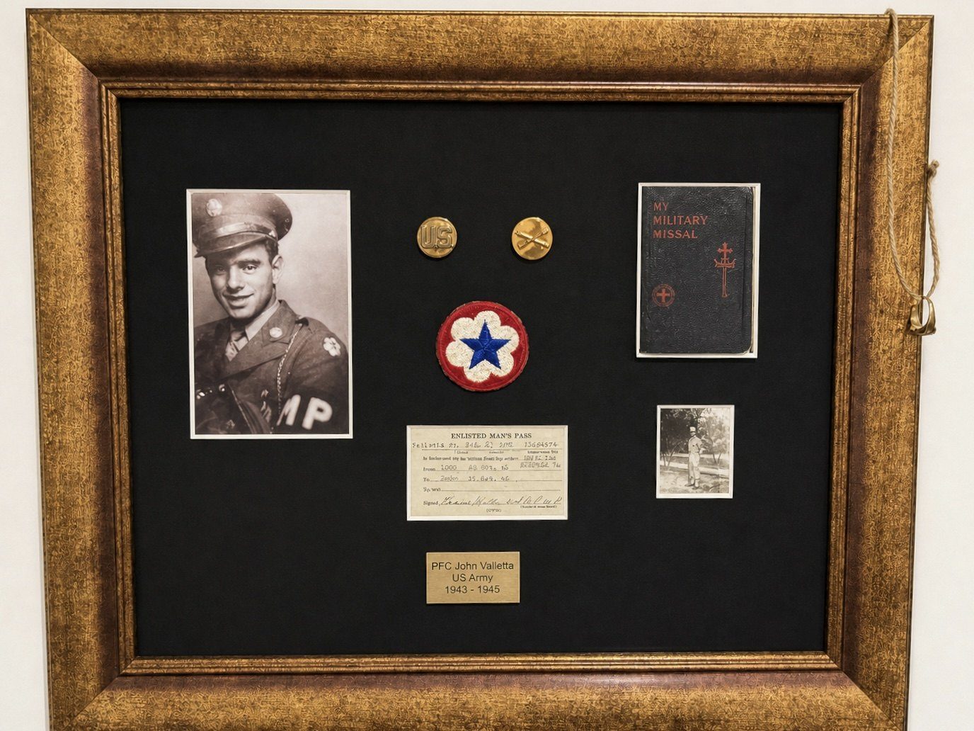 The frame. The plaque reads PFC John Valletta, US Army, 1943-1945.