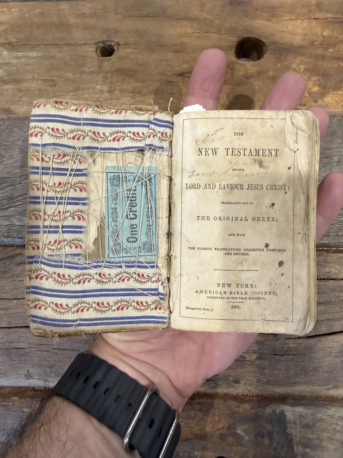 The New Testament, open to its 1863 title page.