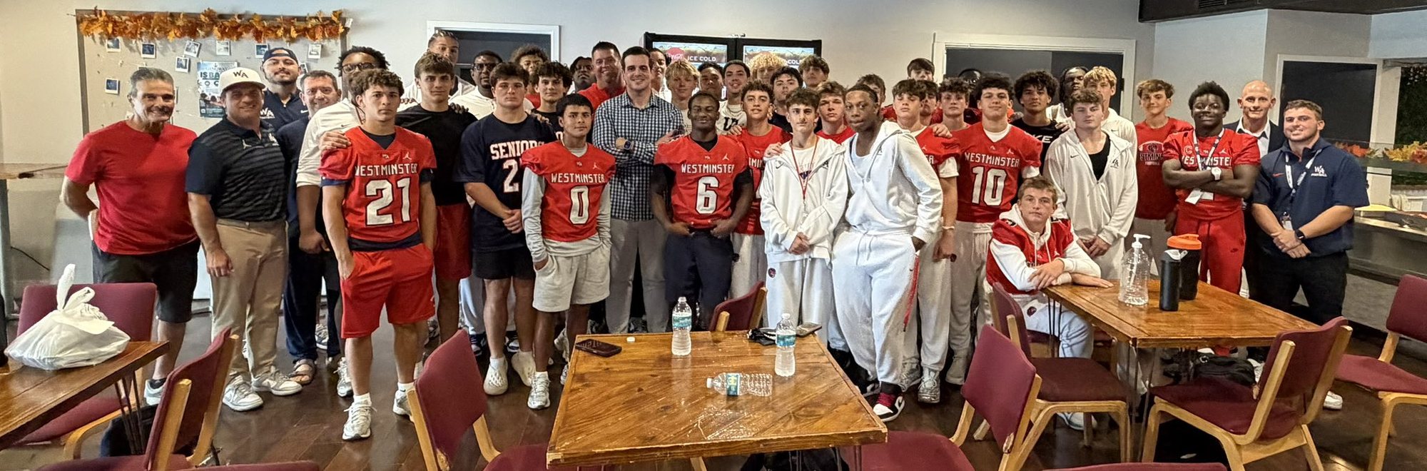 Chris Valletta with the Westminster Academy football team and coaches after the Homecoming Chapel service